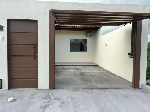 a garage with a brown door in a house at Casa Terra in Prado