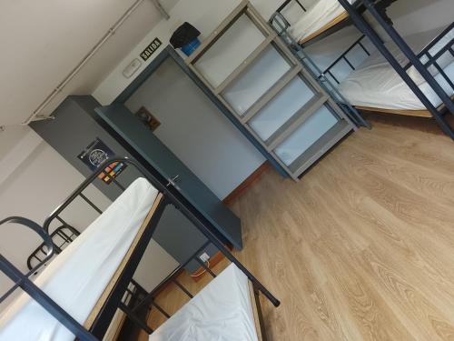 an overhead view of two bunk beds in a dorm room at Albergue Irugoienea in Espinal-Auzperri