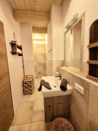 a bathroom with a sink and a mirror at Seyerlehnerhof in Maria Neustift