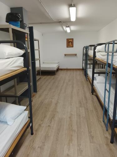 a room with a bunch of bunk beds at Albergue Irugoienea in Espinal-Auzperri