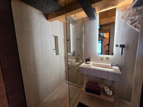 a bathroom with a sink and a mirror at Muranche Loft S1 in Valtournenche