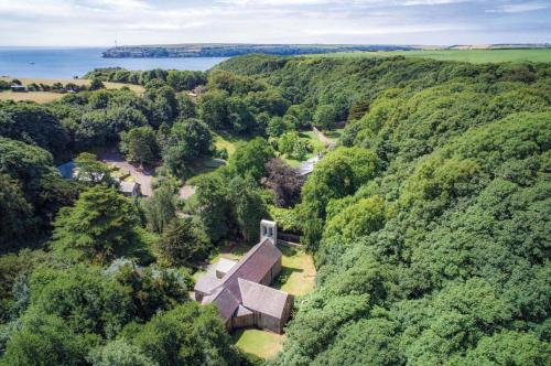an aerial view of a house in the forest at Gofan - 1 Bedroom - St Ishmaels in Saint Ishmaels