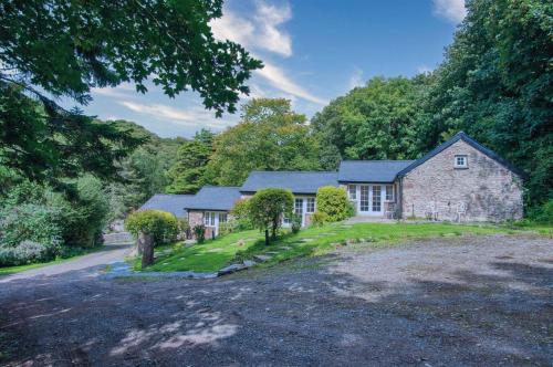 an old stone house in the middle of a forest at Brynach - 1 Bedroom - St Ishmaels in Saint Ishmaels