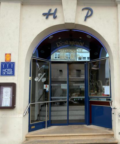 an entrance to a store with a blue door at Logis Hôtel de Paris - Restaurant - Pâtisserie in Saint-Avold