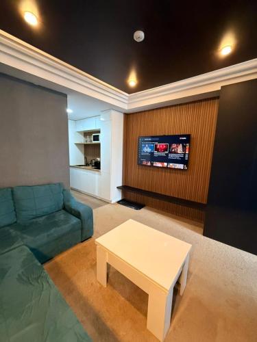 a living room with a couch and a table at New Gudauri Atrium in Gudauri