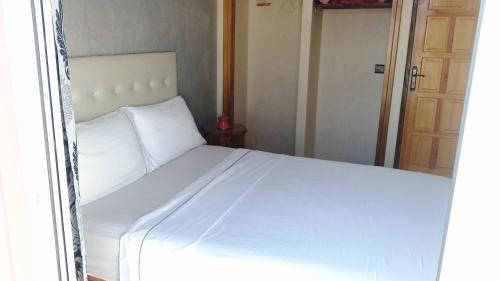 Una cama o camas en una habitación de Asklou Appartement à Mirleft