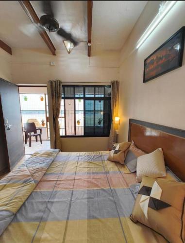 a large bed in a room with a large bed sidx sidx at Tandon Lodge On The Ganga Ghat Homestay in Varanasi