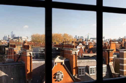a view of a city from a window at Grosvenor House Suites in London