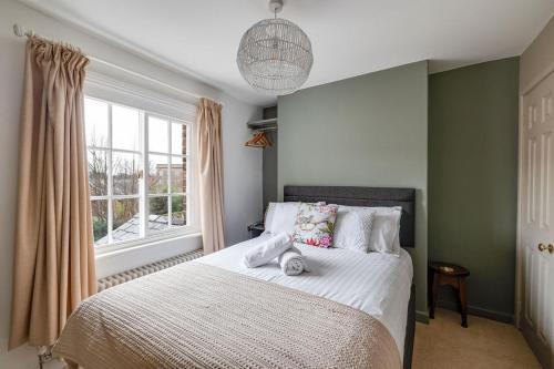 a bedroom with a bed and a window at Gamul Place - Quiet City Centre in Chester