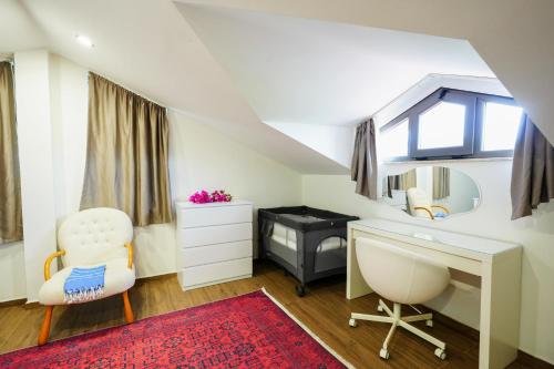 a bedroom with a desk and a chair and a mirror at Villa Lidya in Dalyan