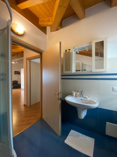 a bathroom with a sink and a mirror at Casa Sole in Vercana