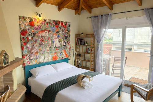 a bedroom with a bed and a painting on the wall at Purerest Entire Private Villa in Athens