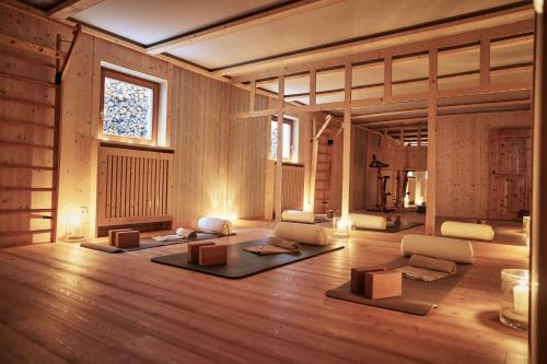a living room with chairs and a large window at Goldene Rose Karthaus a member of Small Luxury Hotels of the World in Senales