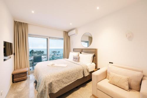 a hotel room with a bed and a couch at Senator Lux in Ulcinj