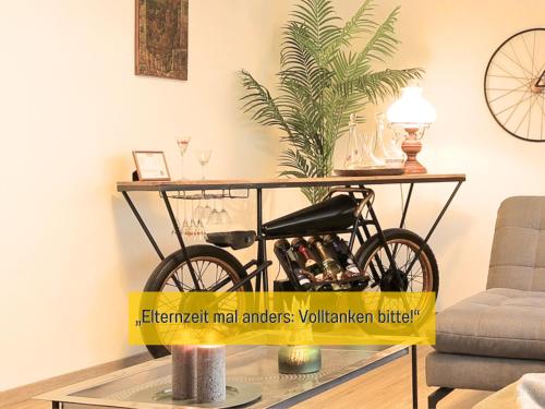 a bike on a table in a living room at Ferienhaus Däschinger in Mastershausen
