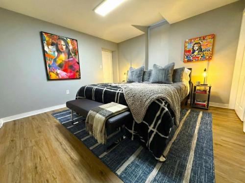 a bedroom with a bed and a painting on the wall at Crossroads at Park Place in Wilmington