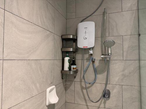a shower in a bathroom with a shower at Skytrees Bukit Indah by HCK Travelers Pause 2BR 1BA 3min in Johor Bahru