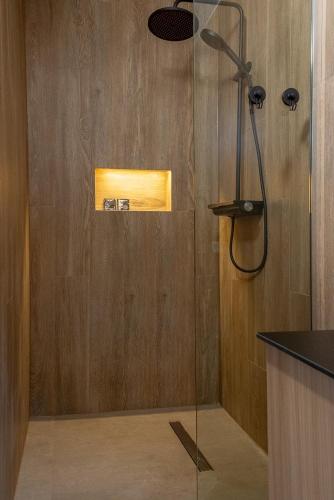 a shower with a glass door in a bathroom at Luani appartments in Krefeld