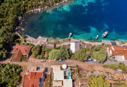 an aerial view of a house next to the water at Villa Marisari in Otok Lastovo