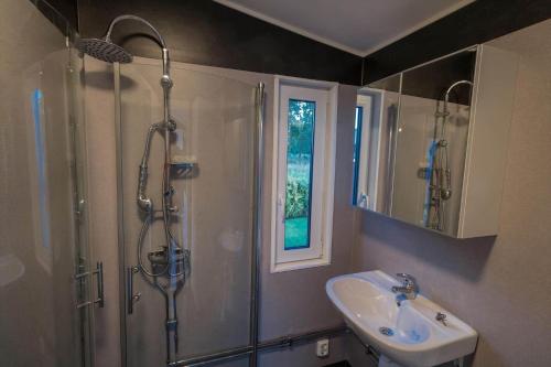 a bathroom with a shower and a sink at OGO827-Vreta-Kloster-Sjoebacka-17 in Vreta Kloster
