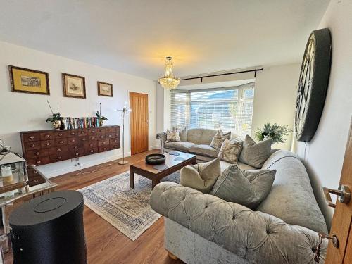 a living room with a couch and a table at The Annexe in Peacehaven