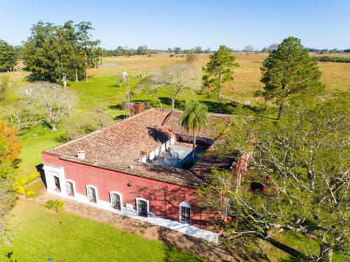 an aerial view of a house in a field at La estancia Yapeyú in Yapeyú