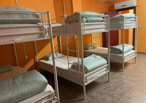a group of bunk beds in a room at Hostel valencia ruzafa in Valencia