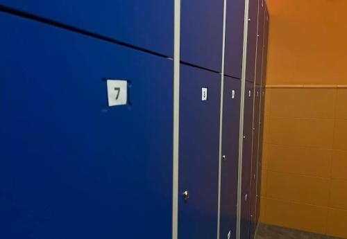 a row of blue lockers in a room at Hostel valencia ruzafa in Valencia
