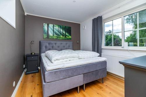 a bedroom with a bed in a room at VGO824-Boras-Nabbagatan-38 in Borås