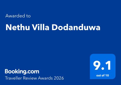 a blue sign with the words neufyn villa dojadova at Nethu Villa Dodanduwa in Dodanduwa