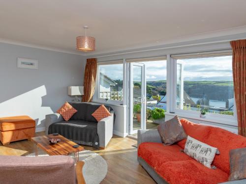 a living room with a couch and a table at Bosula in Fowey