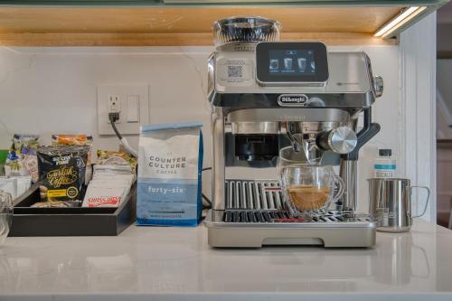 a coffee maker sitting on top of a counter at Brooklyn Gem 3 Blocks to Prospect Park - 3 King Beds 1 Queen, Free parking, in Brooklyn