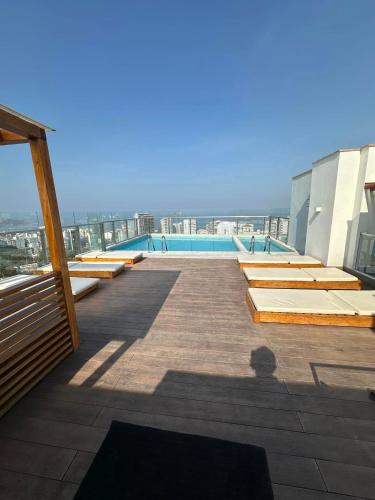 a view of a swimming pool on top of a building at Inca inn apartments in Lima