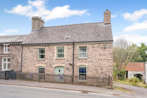 an old brick house with a fence at 2 Bed in Defynnog oc-t32724 in Sennybridge