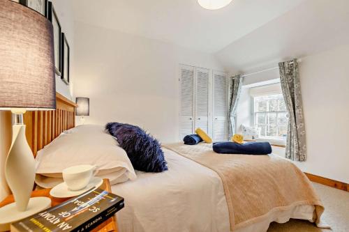 a bedroom with two beds and a window at 2 Bed in St. Minver oc-p27580 in Saint Minver