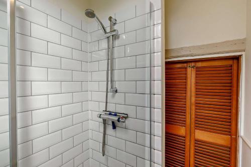 a shower in a bathroom with white tiles at 2 Bed in St. Minver oc-p27580 in Saint Minver