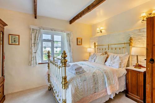 a bedroom with a bed and a window at 1 Bed in Duloe oc-b29367 in Duloe