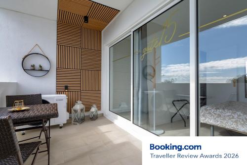 a dining room with a table and a window at gate15 in Machico