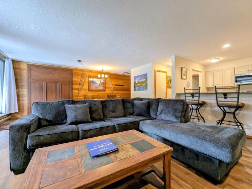a living room with a couch and a table at Montezuma 1770 by SummitCove Lodging in Colorado in Keystone