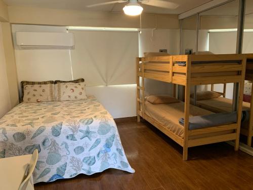 Llit o llits en una habitació de Apartamento parcha