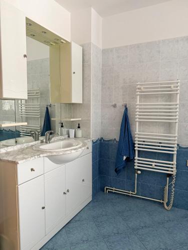 a bathroom with a sink and a mirror at Chata pod Radhoštěm in Trojanovice