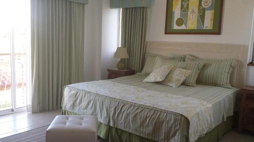 Кровать или кровати в номере Appartamento Cadaques Bayahibe