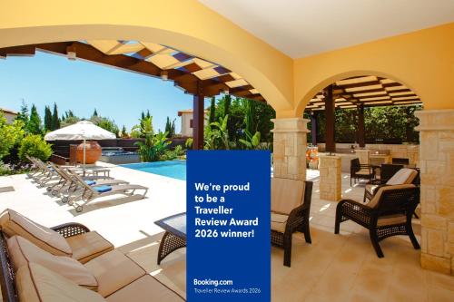 a sign that says were proud to be a turkish relay award winner at Luxury Elite Villa AJ05 complete with a private, climate controlled pool and a relaxing outdoor Jacuzzi, Aphrodite Hills Resort in Kouklia