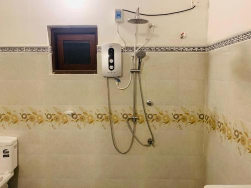 a shower in a bathroom with a shower at Anjana Villa in Katunayaka