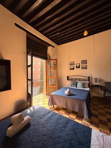 a bedroom with a bed and a television in a room at Hotel Zamora Downtown CDMX in Mexico City