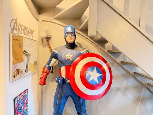 a statue of a superhero holding a shield at Disney Avengers House in Magny-le-Hongre