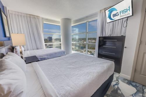 a hotel room with two beds and a window at Amazing Oceanfront 2BR condo with pools and views in Myrtle Beach