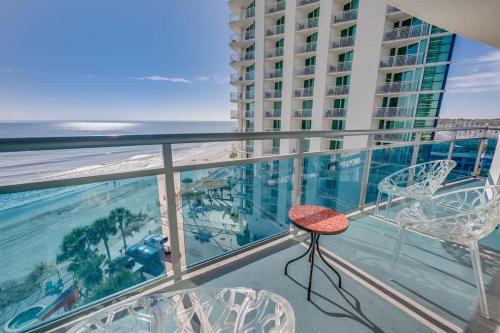 a balcony with chairs and a view of the ocean at Amazing Oceanfront 2BR condo with pools and views in Myrtle Beach