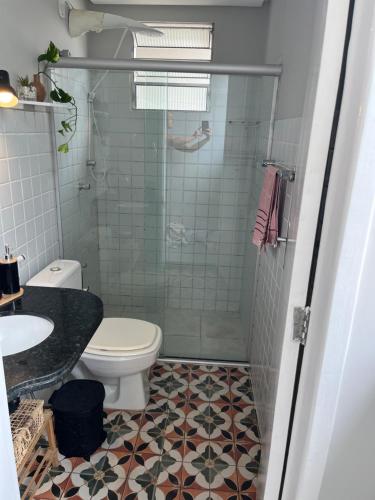 a bathroom with a shower and a toilet and a sink at Casa aconchegante em Aracaju na Aruana in Aracaju