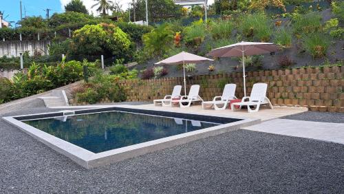 Piscina a Résidence Paradis o a prop